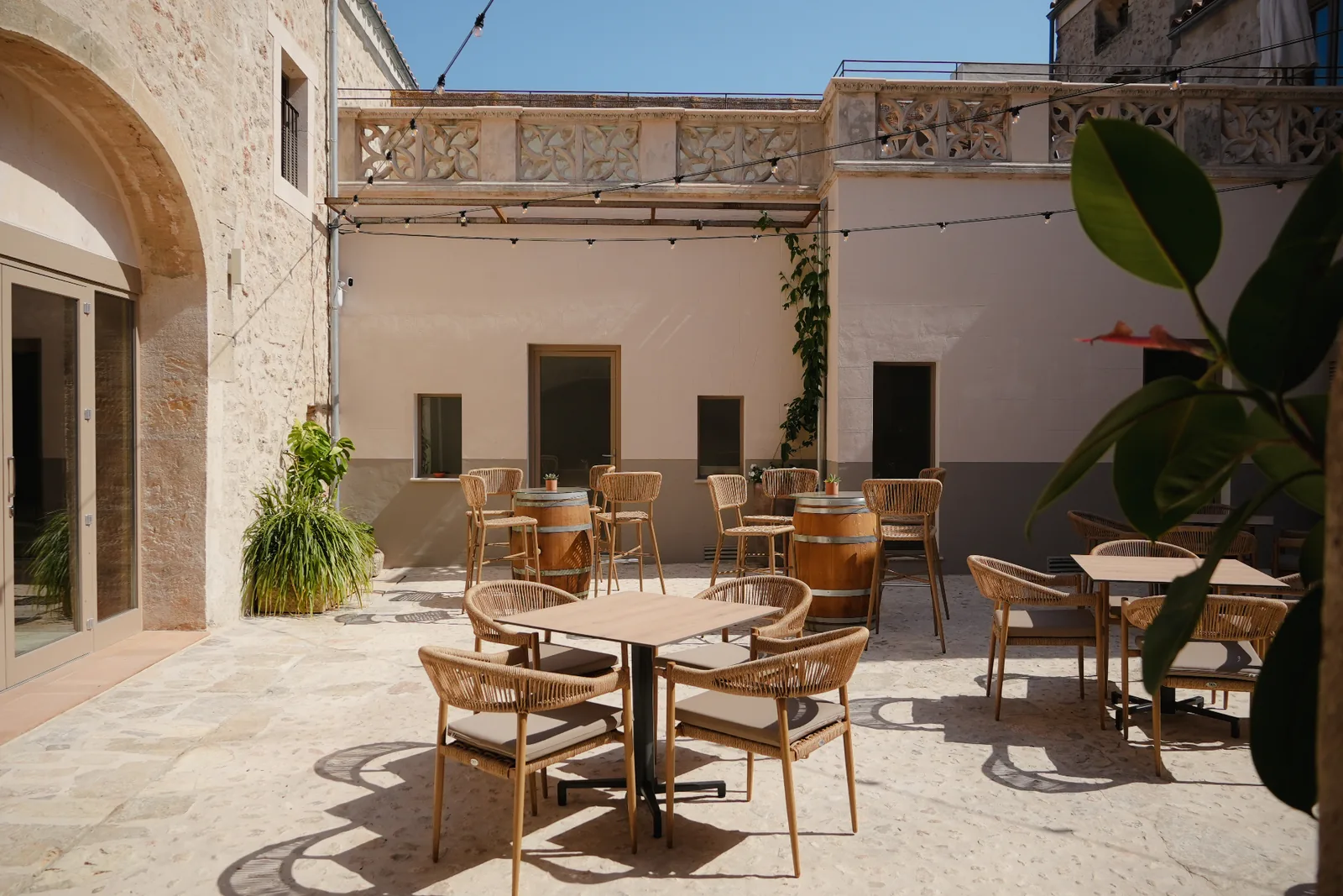 Sunlit courtyard terrace at BYTRA Boutique Hotel
